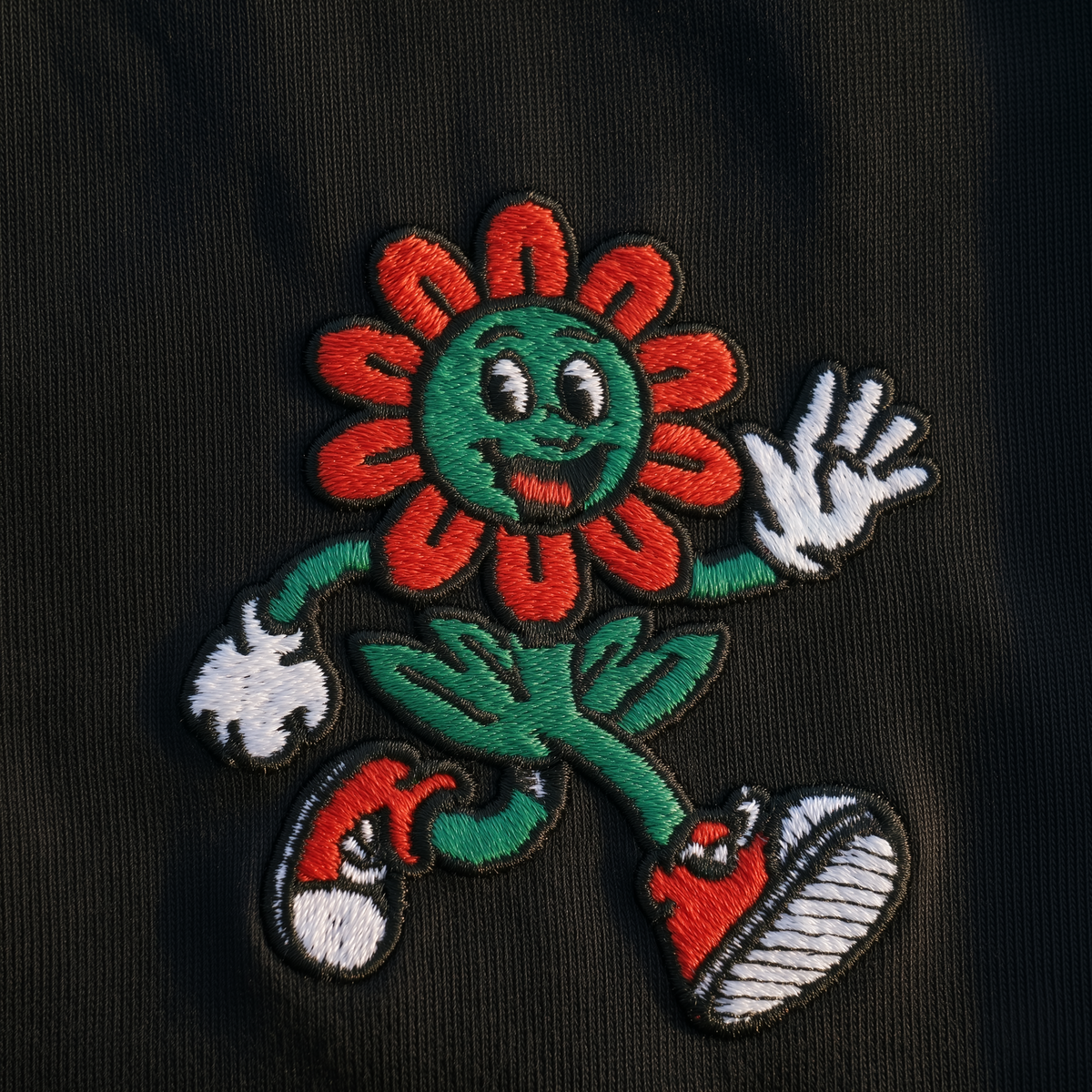 FIOR embroidered logo detail on Essential Tee black